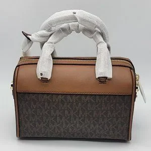 大人気★MICHAEL KORS★TRAVEL XS DUFFLE XBODY Michael Kors XS Travel Duffle Xbody Bag in Light Cream at